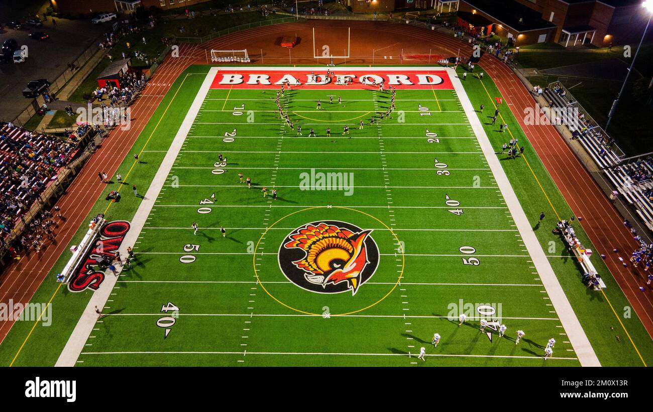An aerial view of the football court with the teams preparing for a