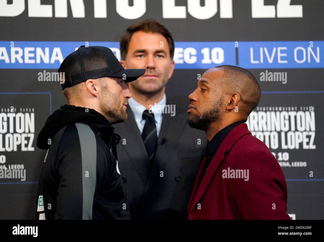 Boxing promoter Eddie Hearn (centre) looks on as James Metcalf (left) and Courtney Pennington face off during a press conference at Aspire, Leeds. Picture date: Thursday December 8, 2022. Stock Photo