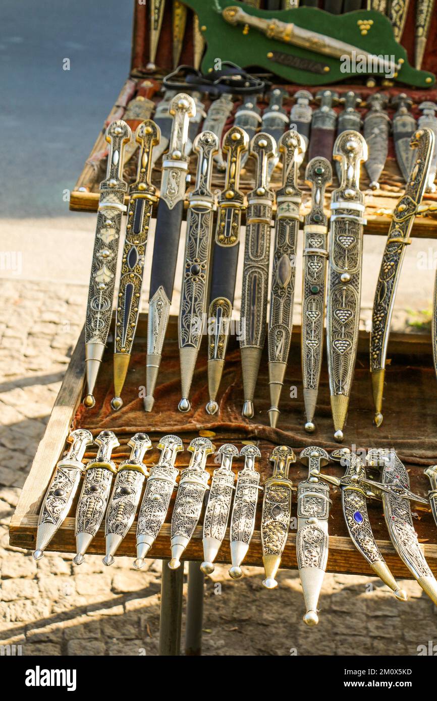 Ancient style daggers in Bazaar of Tbilisi Stock Photo