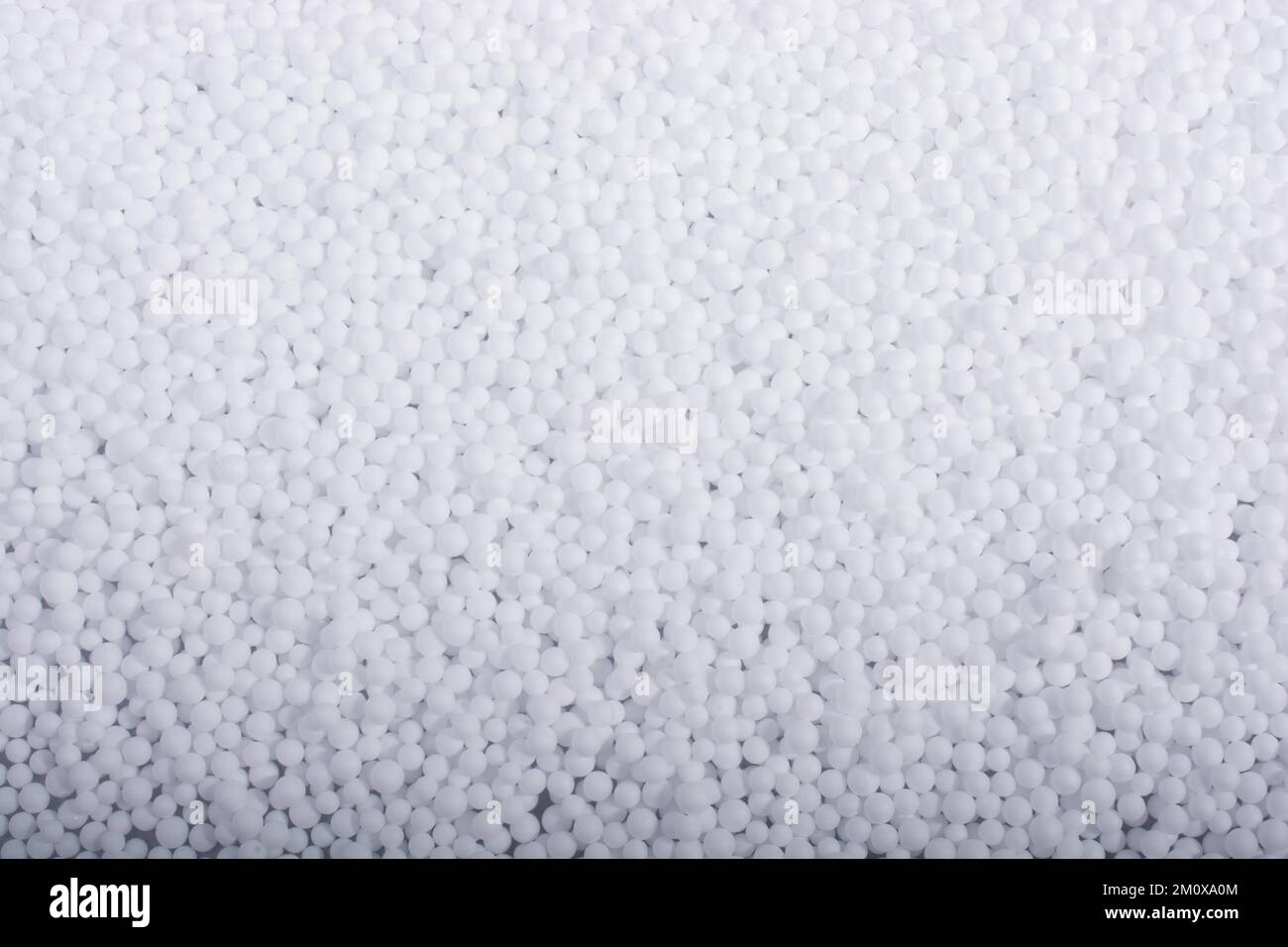 White little polystyrene foam balls as background Stock Photo - Alamy