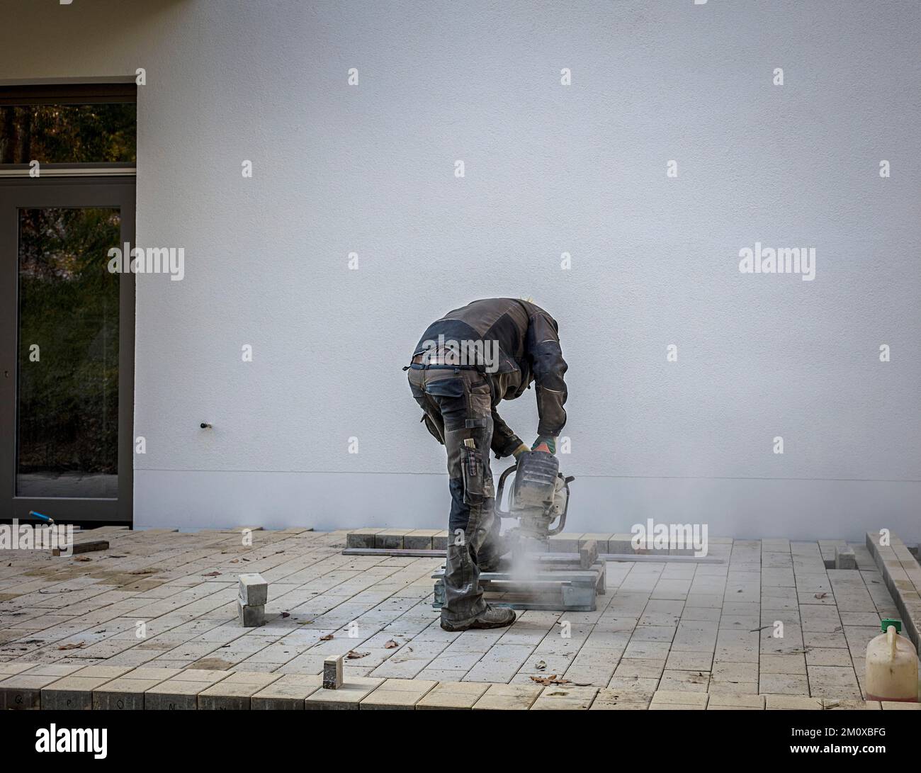 Construction worker working with an angle grinder, Berlin, Germany, Europe Stock Photo