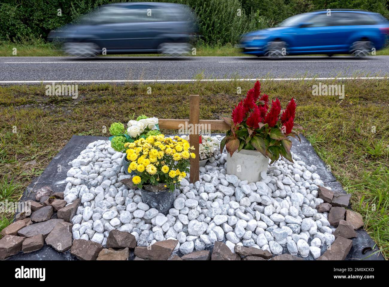 Memorial with cross for victims of road accident on country road ...