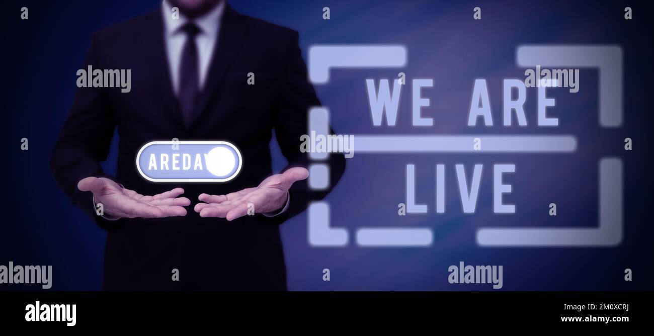 Text caption presenting We Are Live, Word Written on continuous report or chat that is streamed in real time Stock Photo