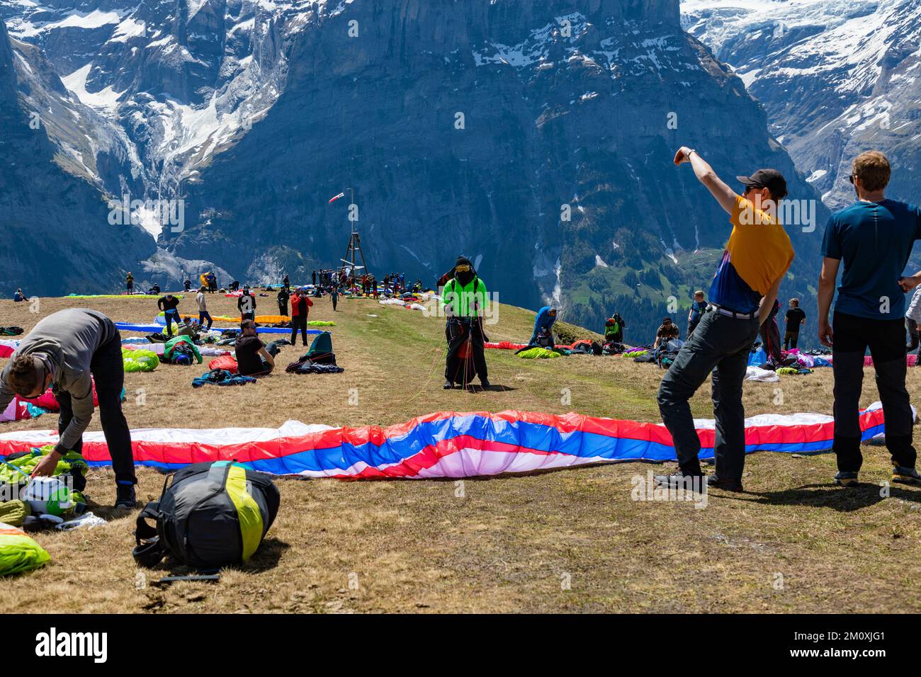 Paragliders waiting and getting their gear ready to take to the skies
