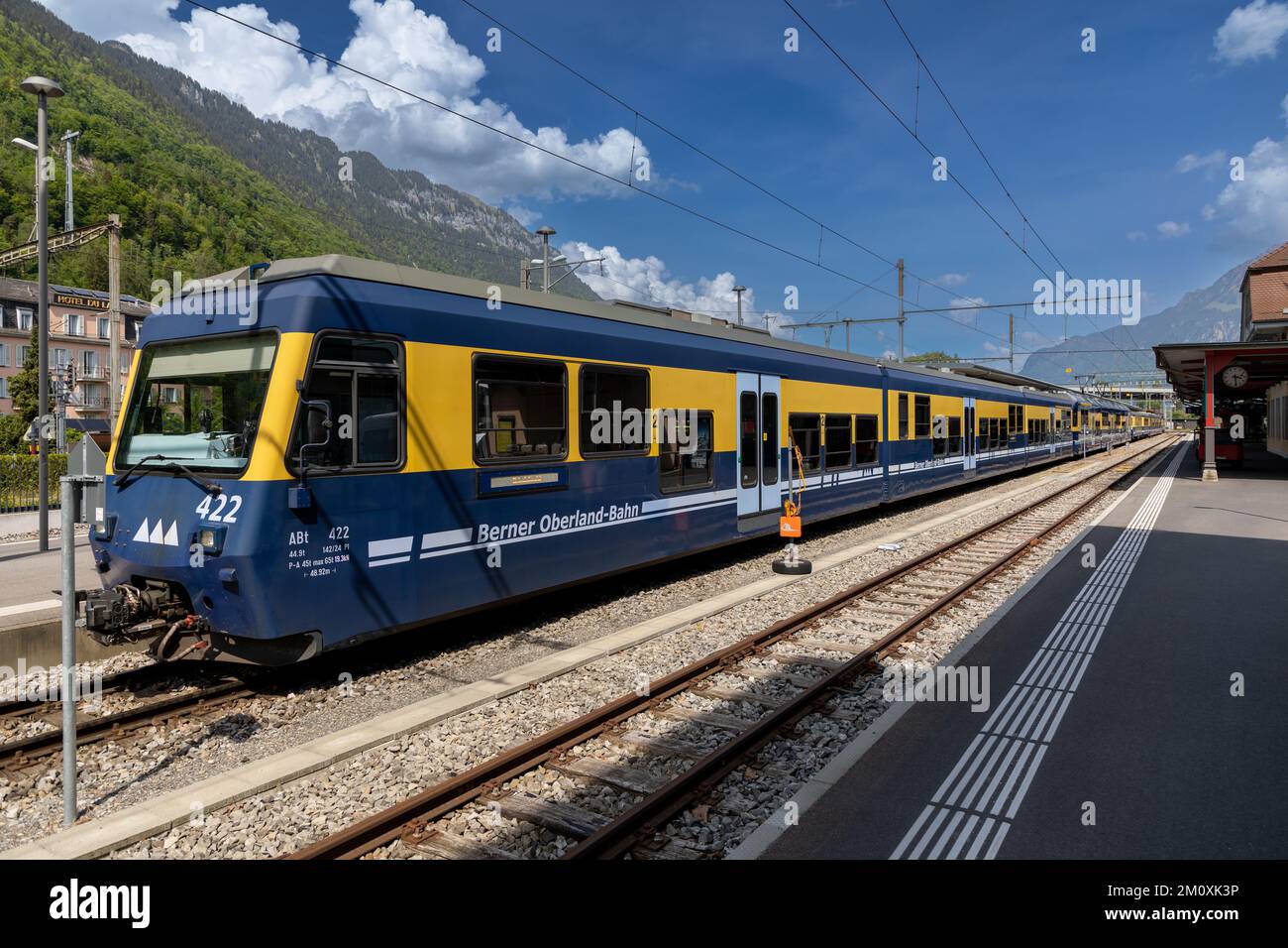 Berner Oberland-Bahn train waiting at the Interlaken Ost station. Stock Photo