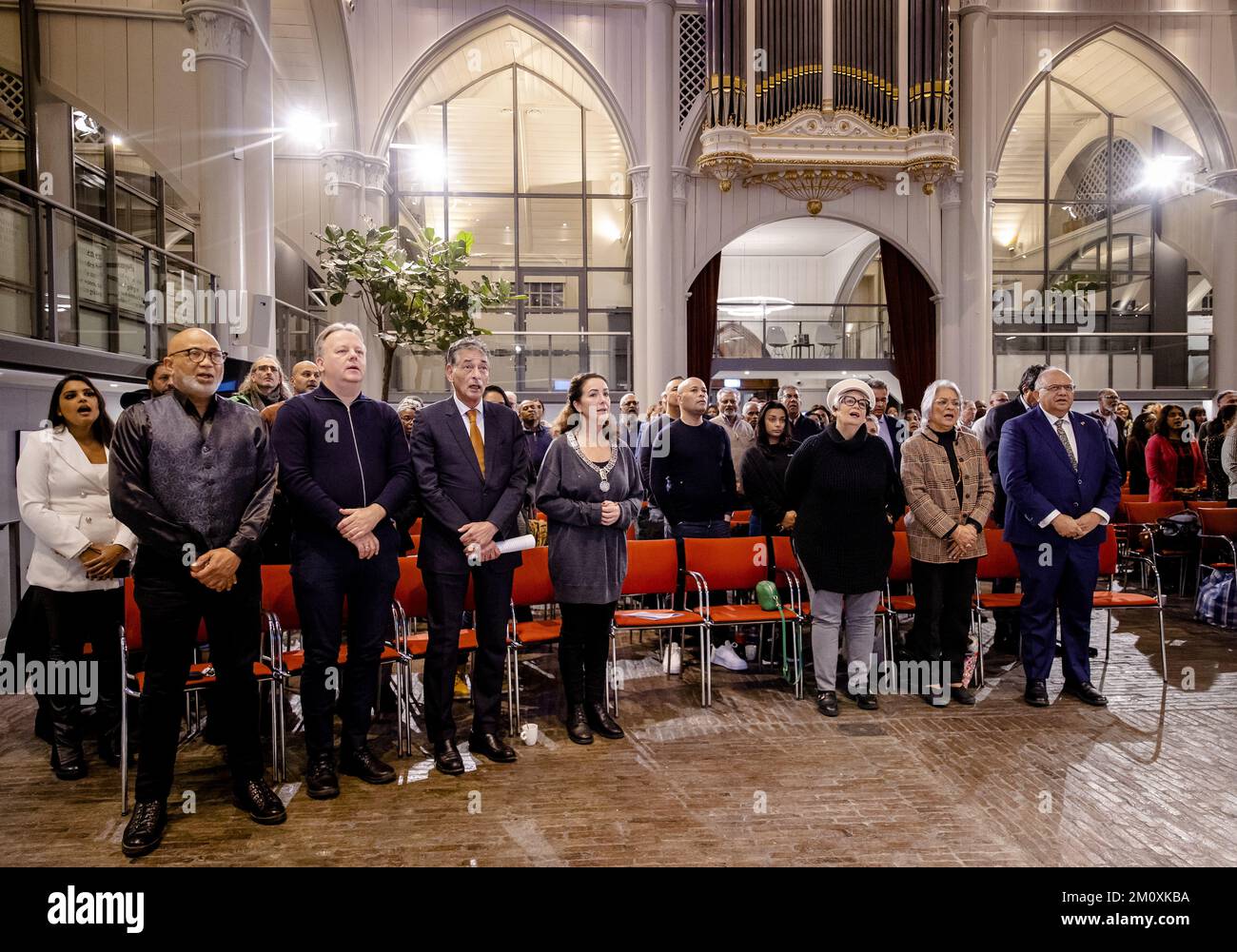 AMSTERDAM - 08/12/2022, Gerard Spong (3rd L) and mayor Femke Halsema (4th L) during the commemoration of the December murders in the Amstelkerk. It is 40 years ago that fifteen prominent Surinamese were murdered under the rule of Desi Bouterse. ANP SEM VAN DER WAL netherlands out - belgium out Stock Photo