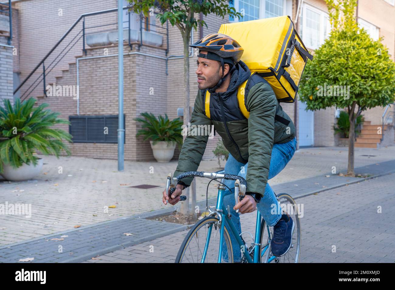 Young African American Delivery Man Riding On Bike Black Courier Young African American Delivery Man Riding On Bike Black Courier