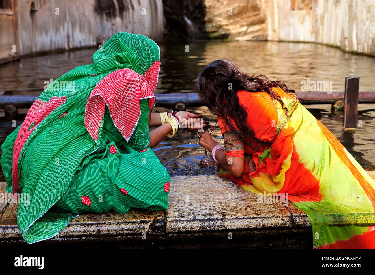 Hindu Indian pilgrims bathing and praying Stock Photo