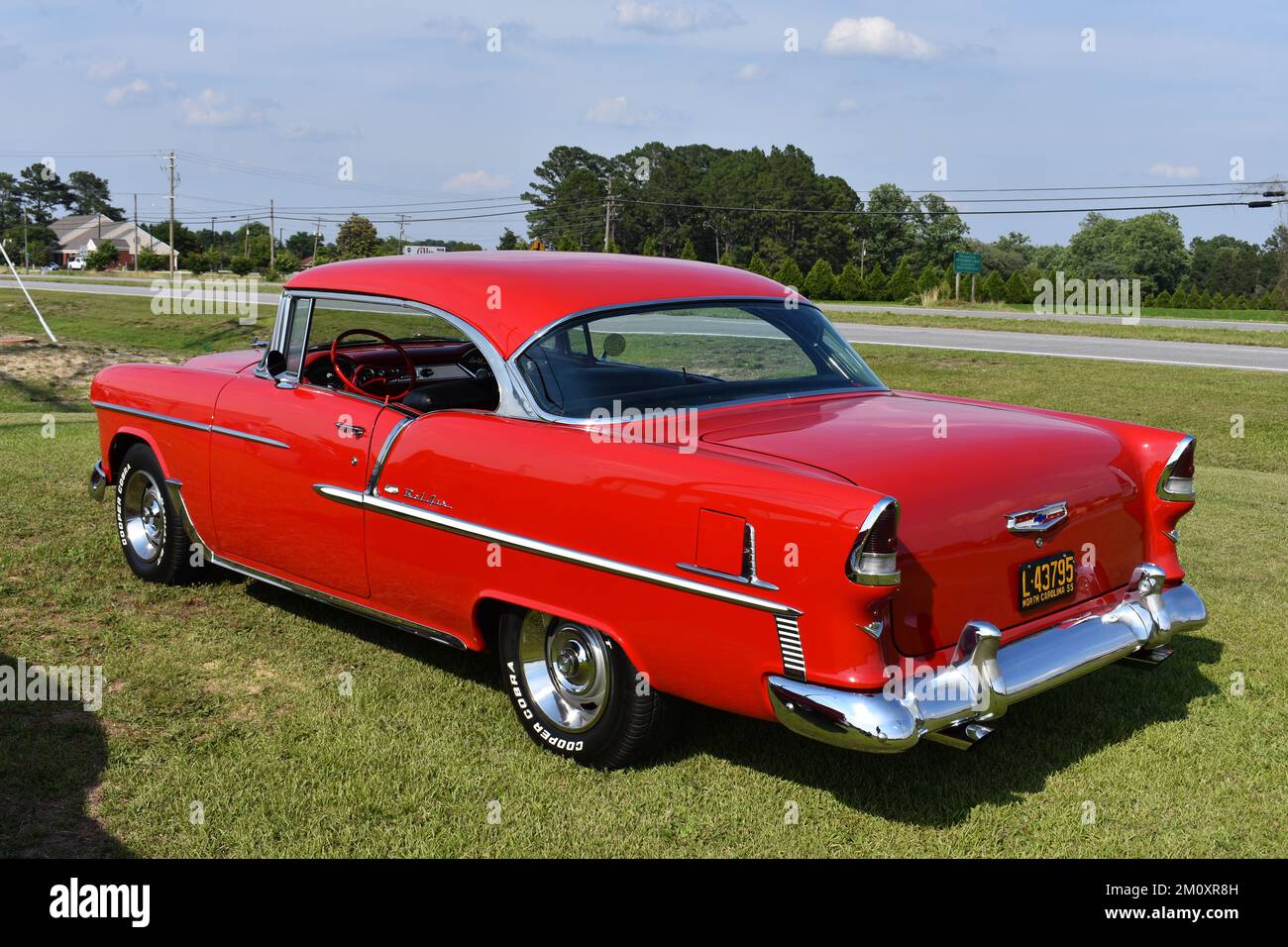 A 1955 Chevrolet Bel Air Hard Top on display at a car show. Stock Photo