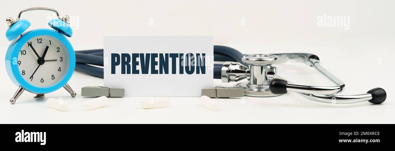 Prevention Clock Medicine and health concept. On an isolated white background there is a ...