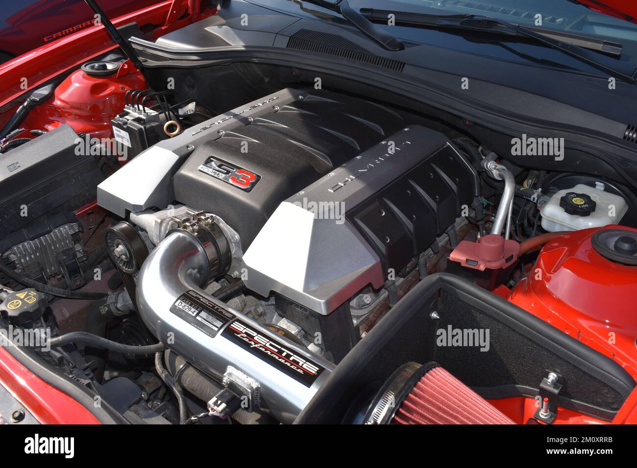A LS3 Chevrolet Engine in a Camaro at a car show. Stock Photo