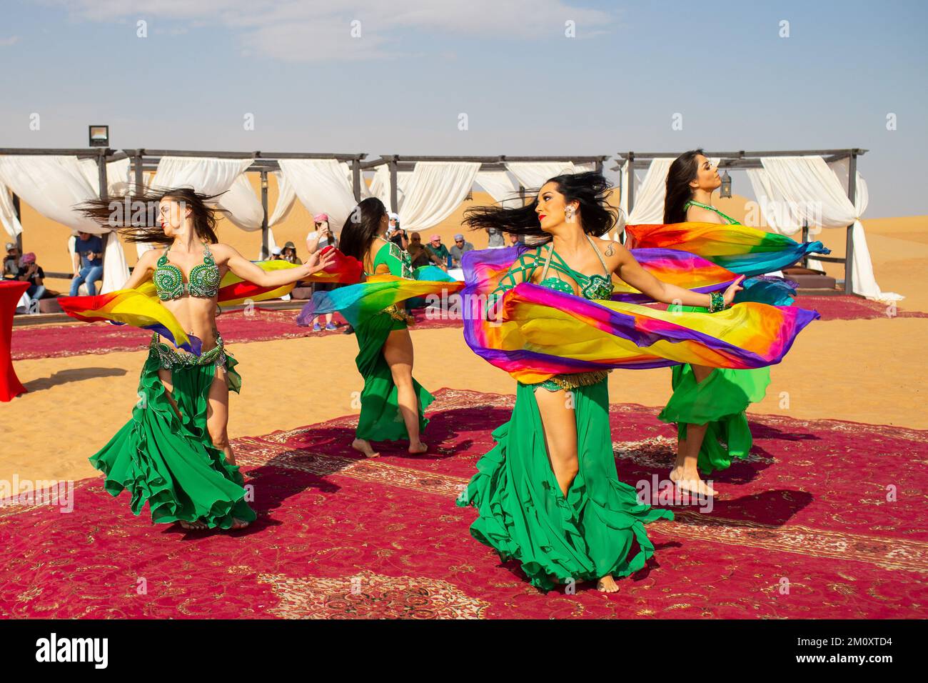 Belly dancers in the Dubai Desert Conservation Reserve. Stock Photo