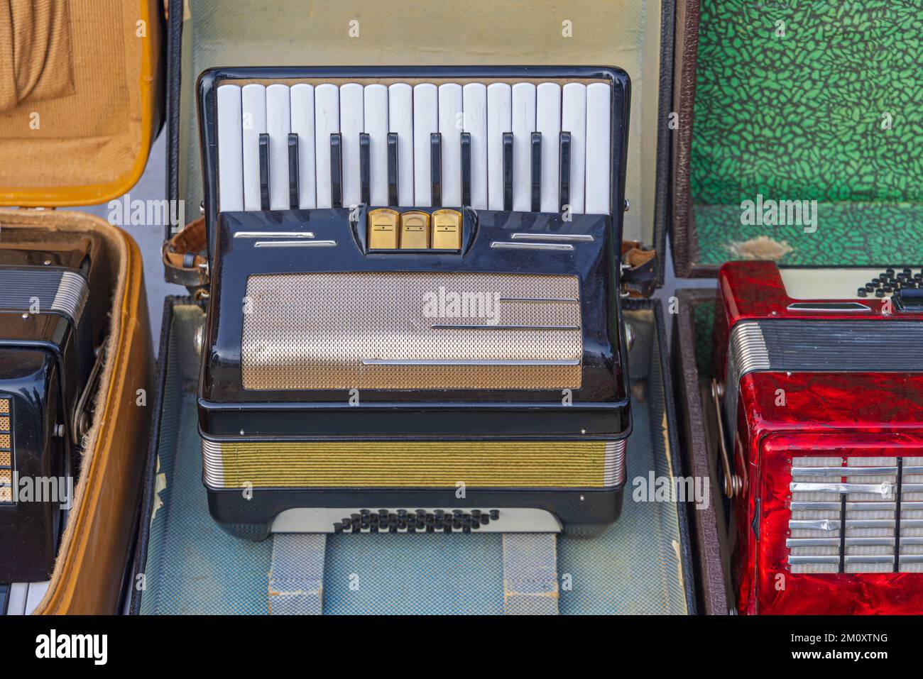 Piano Accordion Musical Instrument in Case at Flea Market Stock Photo