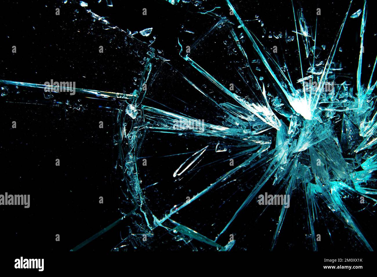 Bullet impact on a sheet of glass Stock Photo - Alamy