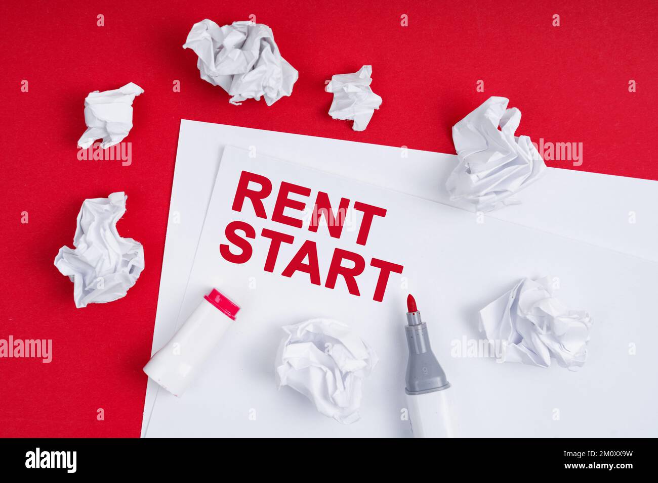 Background For Rent Paper Business and finance concept. On a red background lies crumpled paper ...