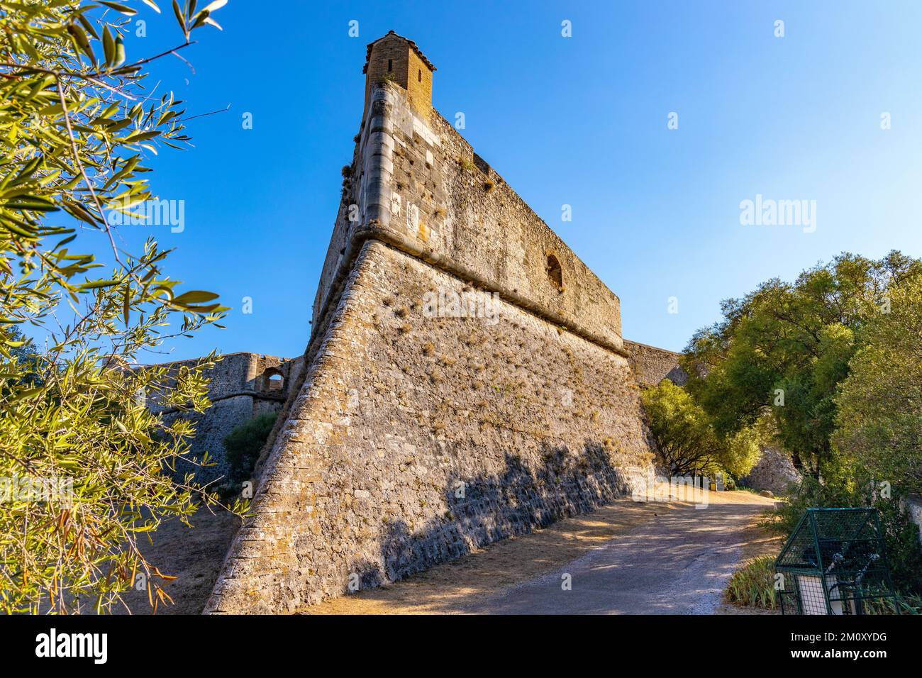 Antibes, France - August 4, 2022: Defense walls and towers of medieval fortress Fort Carre castle in Antibes resort city onshore Azure Cost Stock Photo
