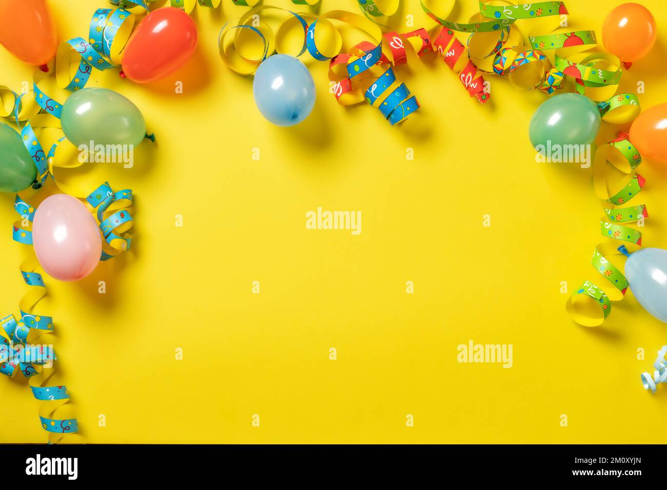 Birthday background top view Party decorations on yellow background with copy space Stock Photo