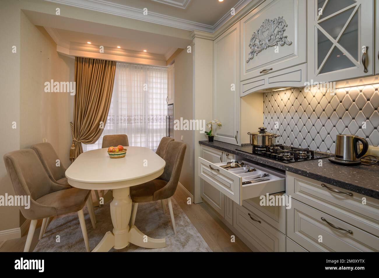 Inviting beige kitchen with a classic design Stock Photo