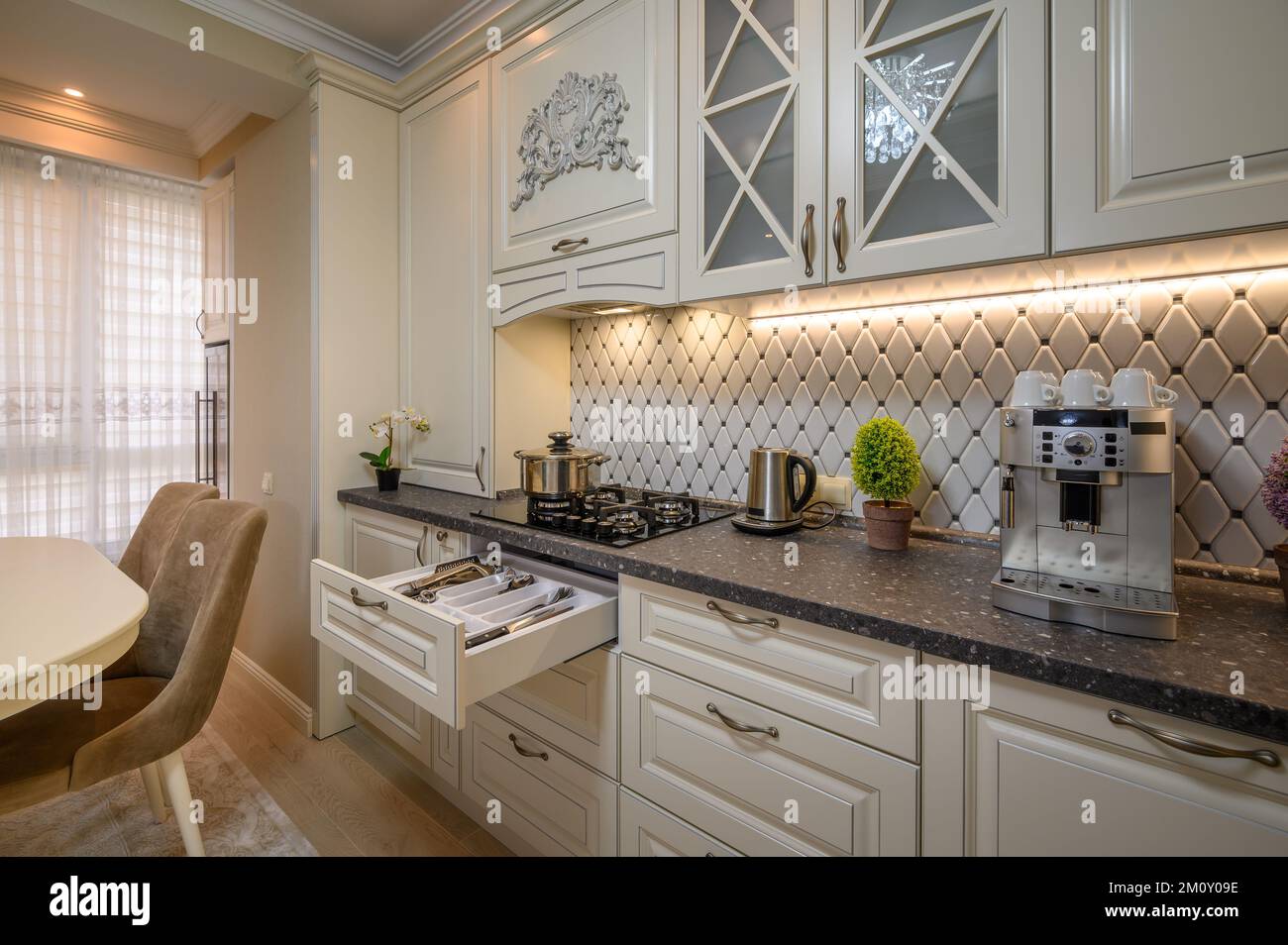 Beige kitchen with a classic aesthetic and modern conveniences Stock Photo Alamy