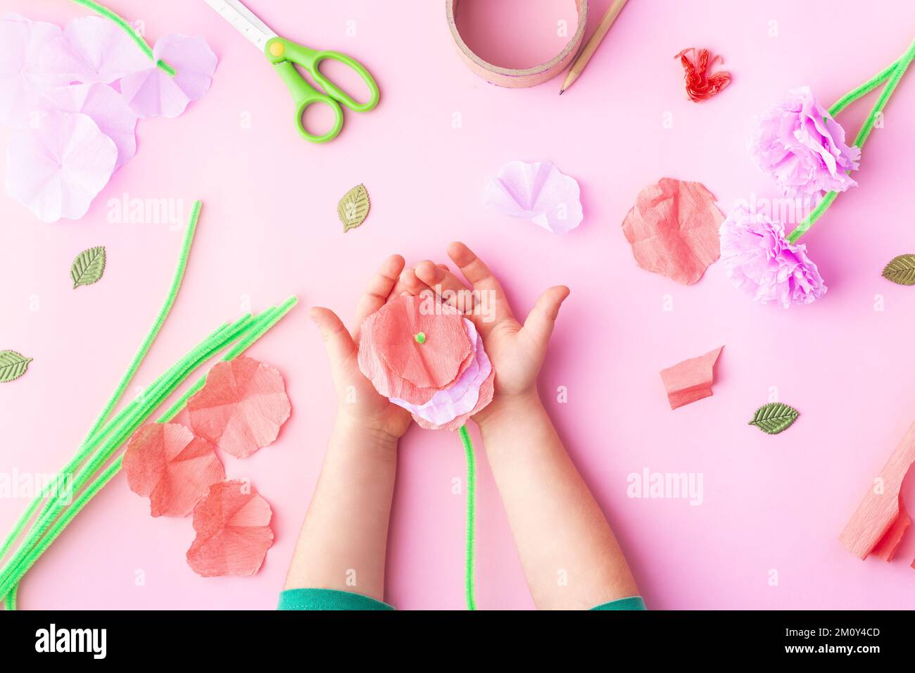 Easy paper flowers craft for kids. Hands. Mother's day. Happy birthday Stock Photo