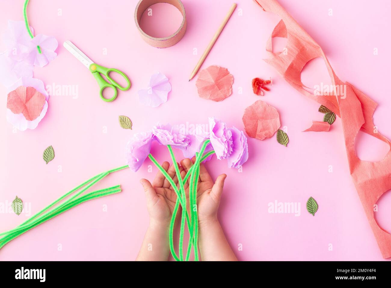 Easy paper flowers craft for kids. Hands. Mother's day. Happy birthday Stock Photo