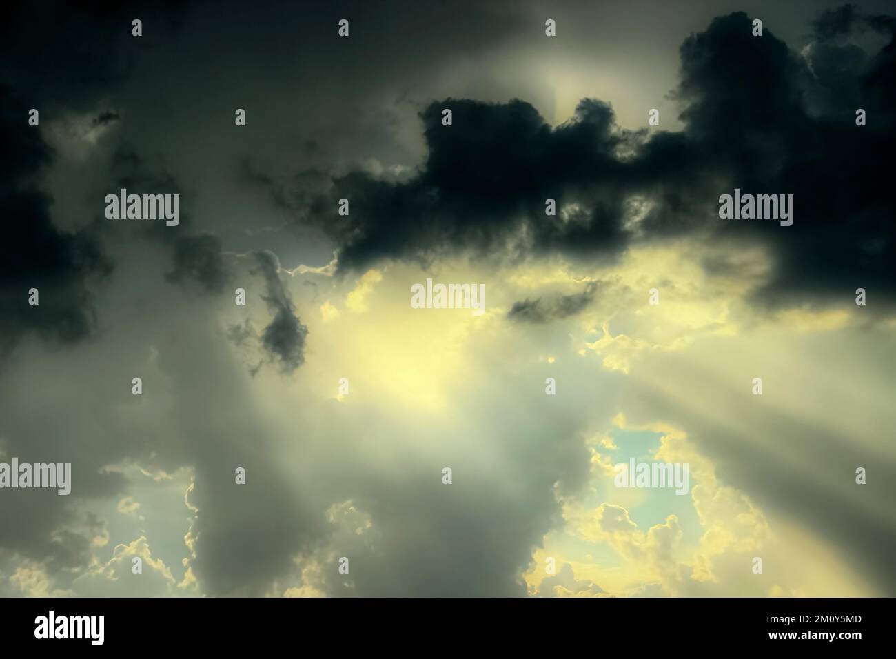 Autumn sky with sun rays through light and soft clouds. Stock Photo
