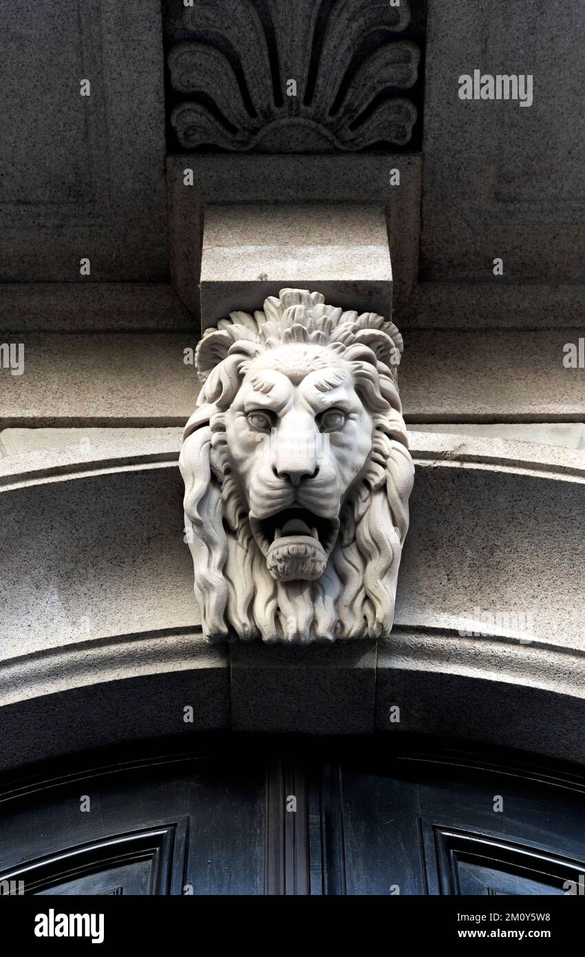 Head of a lion above the entrance of Palazzo Stampa di Soncino, 16th century palace in Milan city center, Lombardy region, Italy Stock Photo