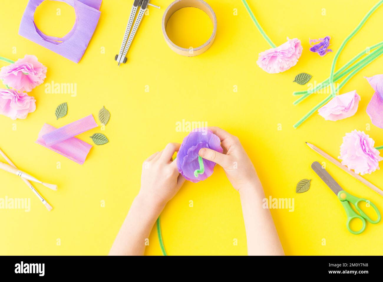 Easy paper craft with kids flowers. Mother's day. Hands. Happy birthday. Stock Photo