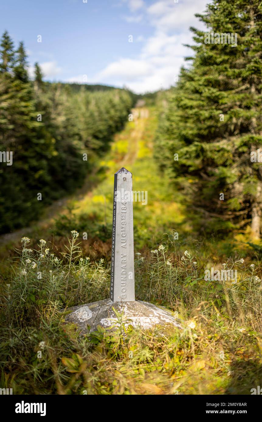 Boundary monument along the USA Canada international border Stock Photo