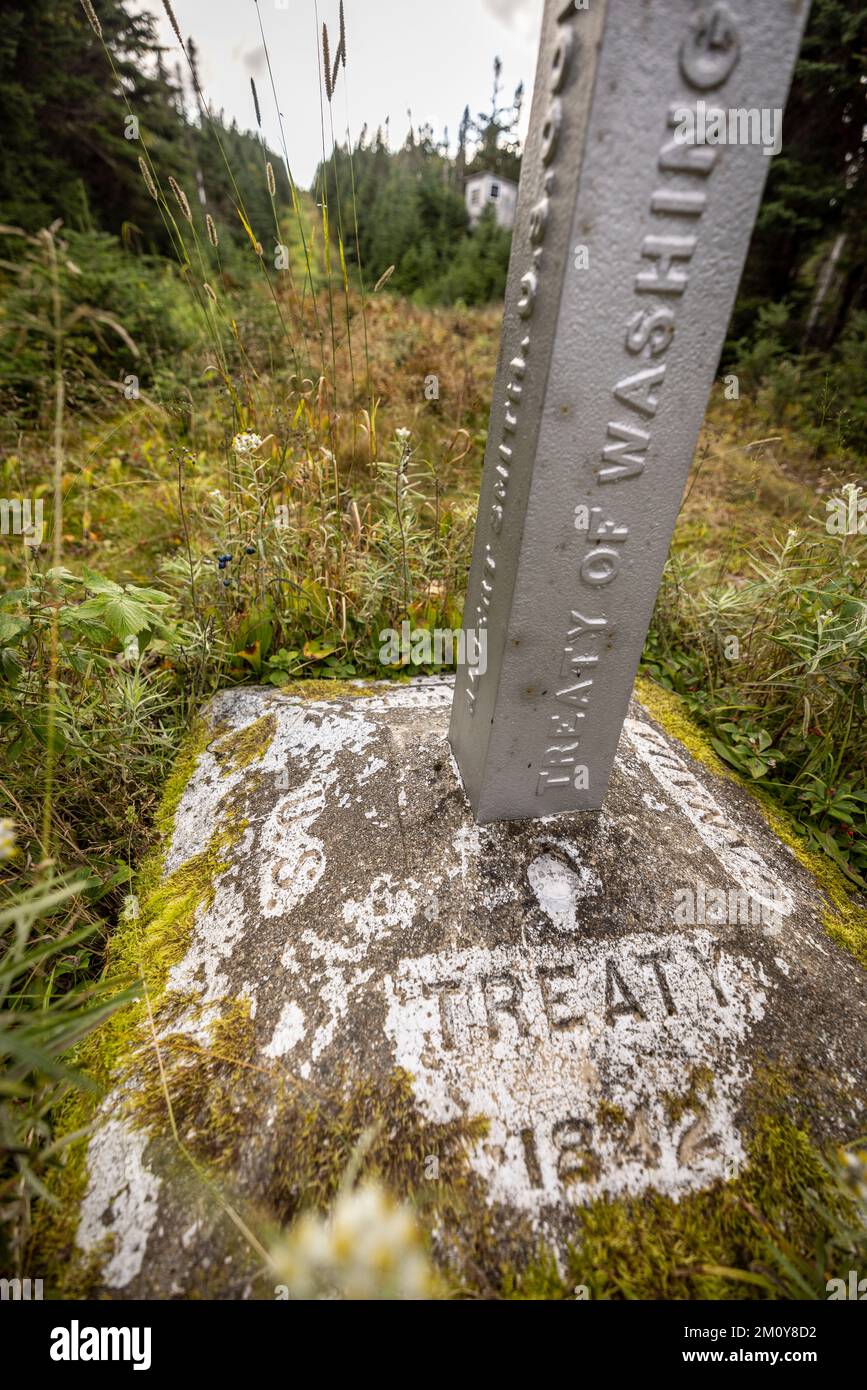 Stone border monument along international Maine and Quebec border Stock Photo