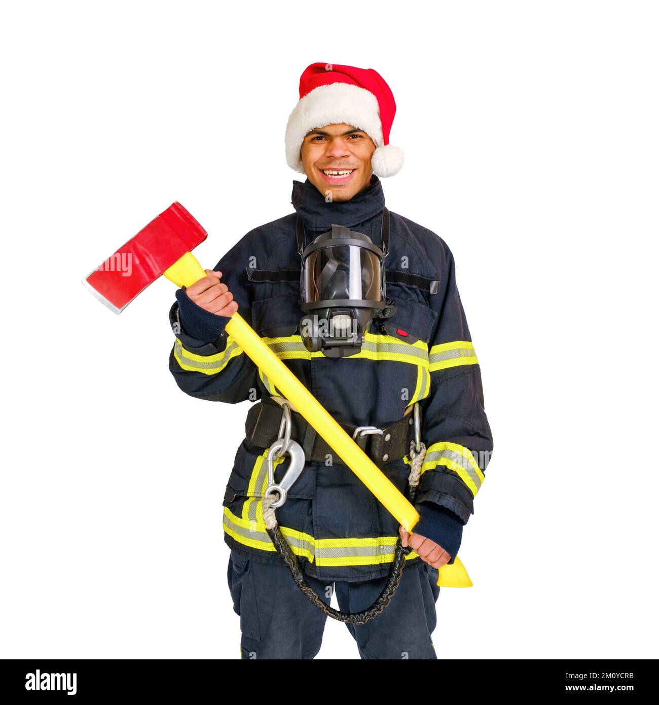 Fireman in red santa hat holds axe in hands isolated Stock Photo