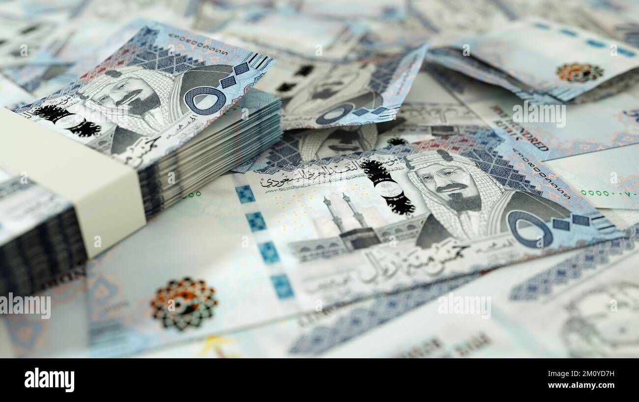close up of Saudi riyal notes spread on table. 3d rendering of money ...