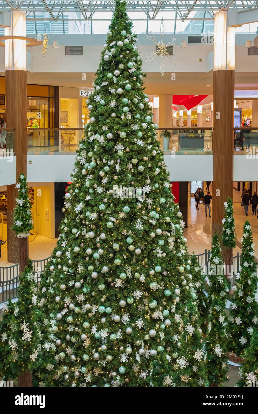 The big christmas tree in the shopping mall. Big bright Christmas tree