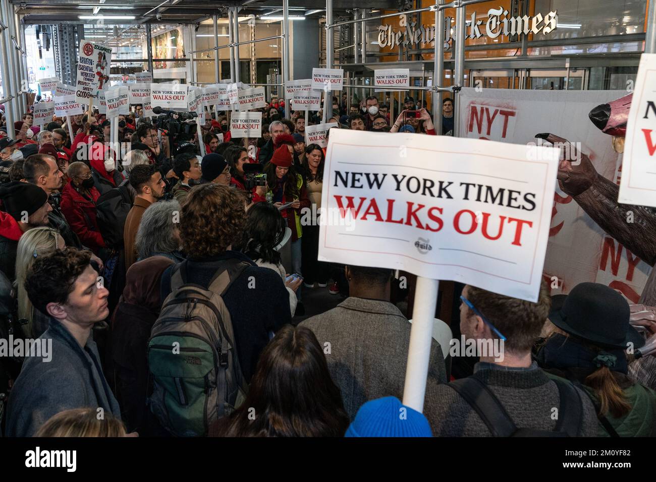 More than 1100 NewsGuild union members of New York Times walked off from work for 24-hours and hold rally on contract dispute in front of NYT Headquarters entrance in New York on December 8, 2022 Stock Photo