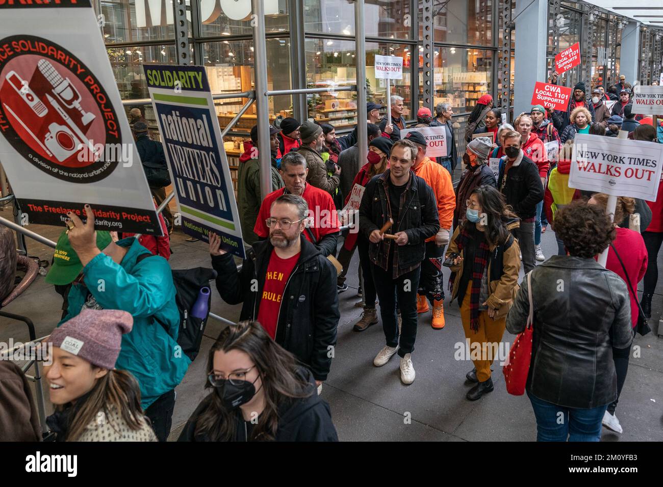 More than 1100 NewsGuild union members of New York Times walked off from work for 24-hours and hold rally on contract dispute in front of NYT Headquarters entrance in New York on December 8, 2022 Stock Photo