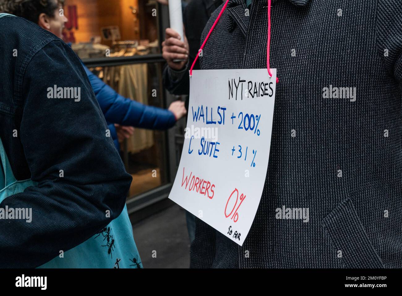 More than 1100 NewsGuild union members of New York Times walked off from work for 24-hours and hold rally on contract dispute in front of NYT Headquarters entrance in New York on December 8, 2022 Stock Photo