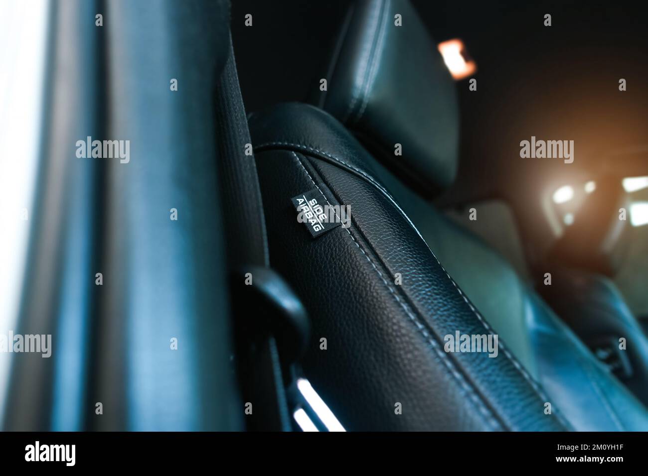 Airbag label on the side of the leather seat inside the car, Airbag system and car safety concept Stock Photo