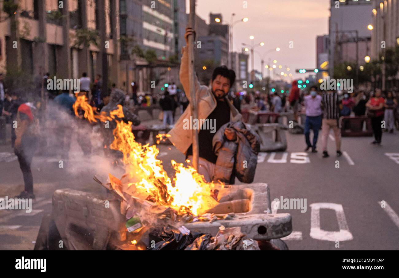 Lima, Peru. 08th Dec, 2022. Supporters of ousted Peruvian President  Castillo light barricades during a demonstration in Lima, Peru. Peru's  Congress voted Wednesday to remove Castillo from office and replace him with