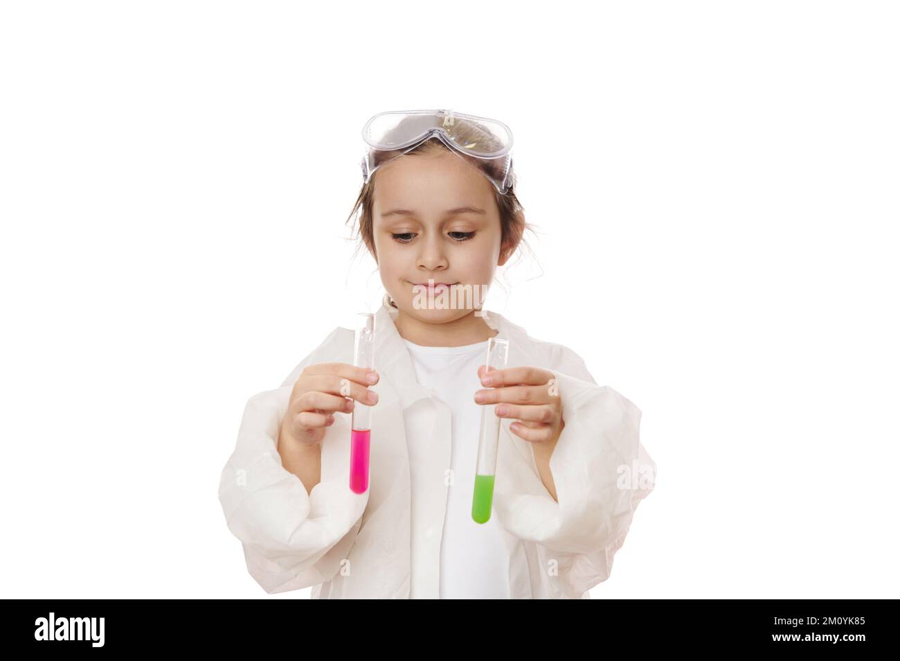 Little girl future chemist, conducts chemical experiments, observes the