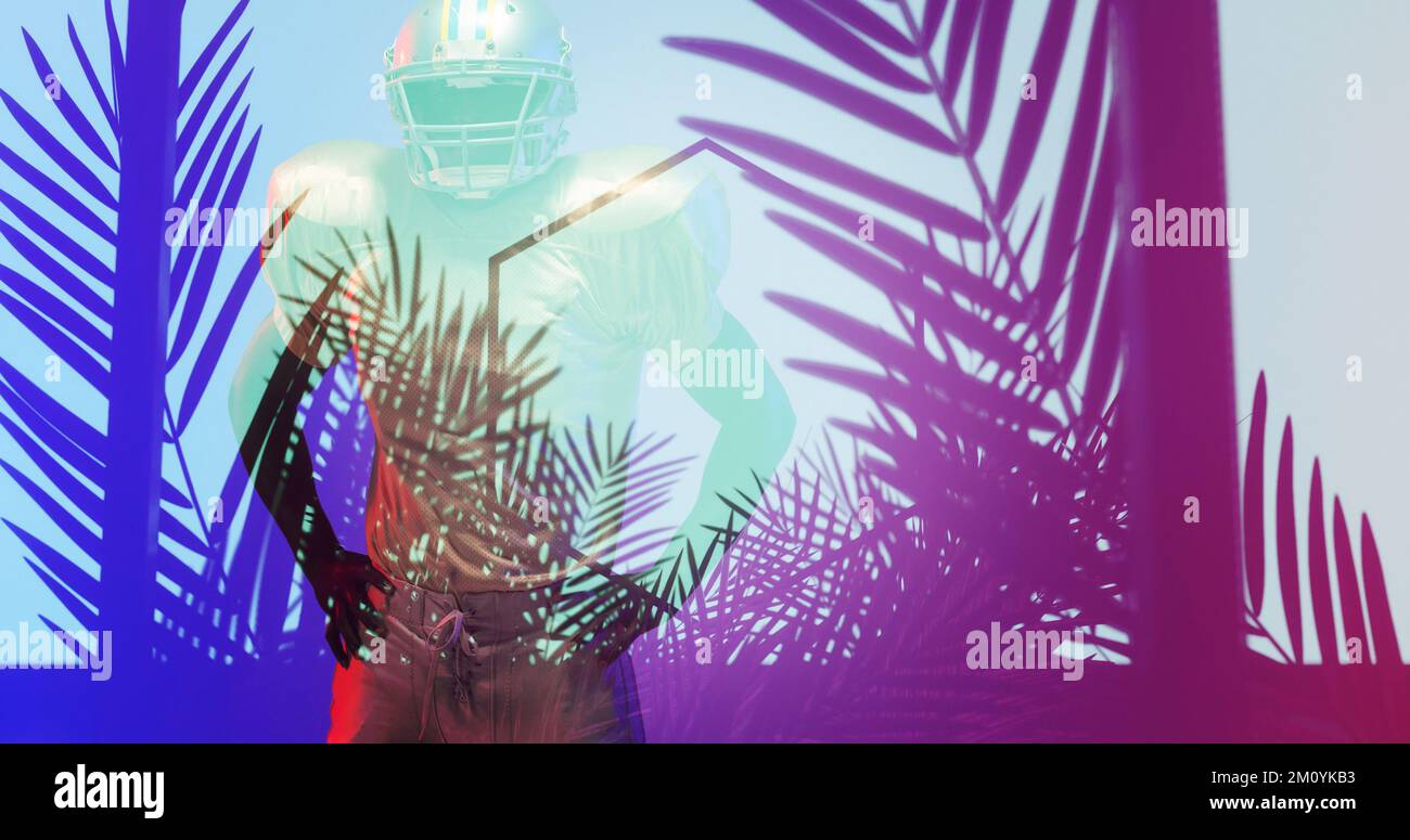 Composite of american football player with hands on hip standing amidst