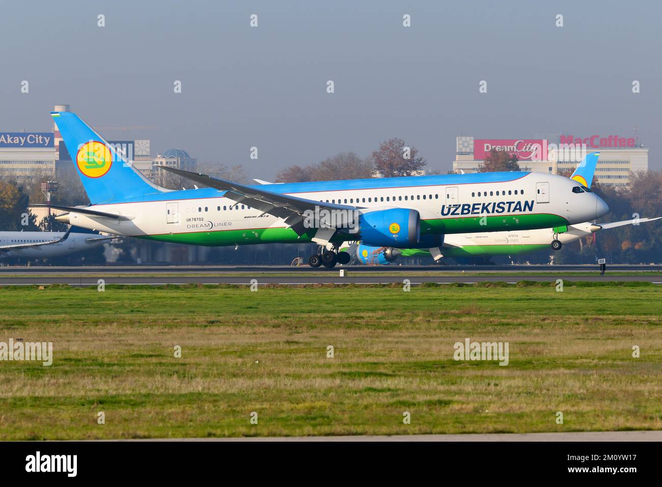Uzbekistan Airways Boeing 787 airplane landing at Tashkent Airport. Aircraft of UZ Airways arrival. Plane B787 Dreamliner registered as UK78702. Stock Photo