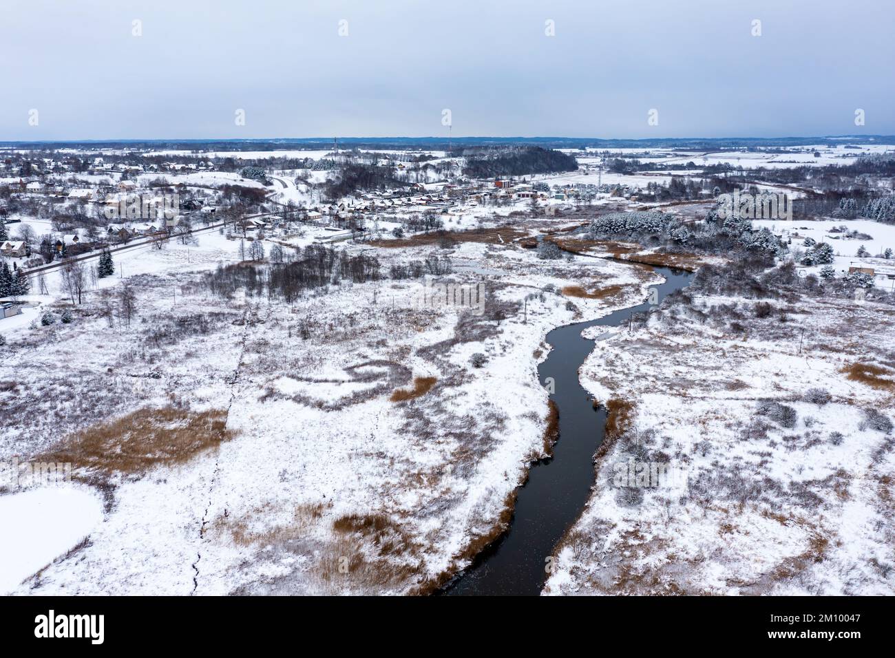 Panoramic Latvian winter landscape with Abava river flowing through the ...
