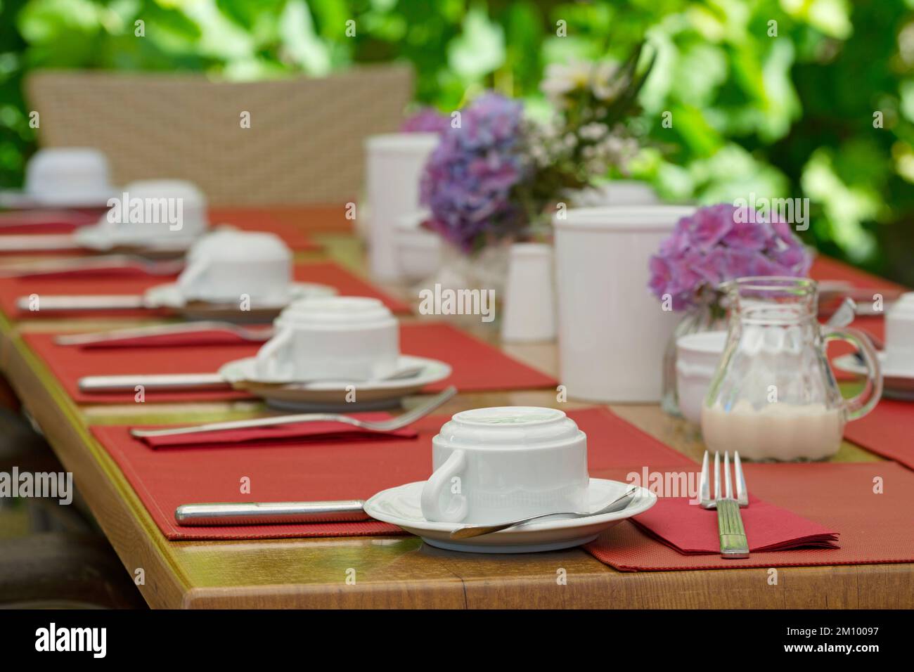 A table set for a celebration in the outdoor area of a restaurant Stock Photo