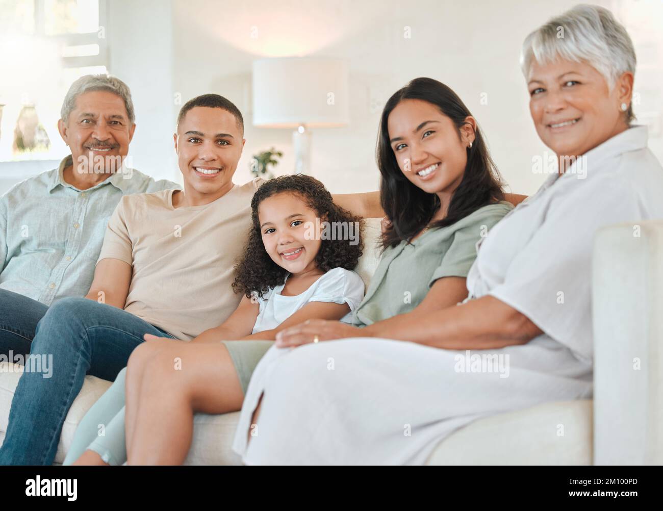 Its always hard leaving here. a beautiful family bonding on a sofa at home. Stock Photo