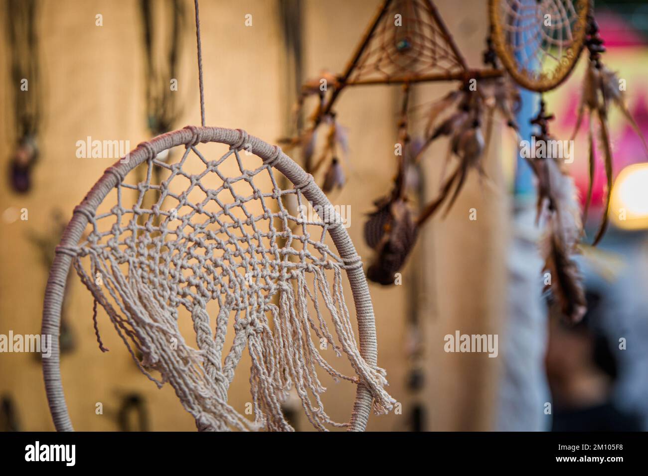 Dream catcher circle against background sunlight. Handmade dream