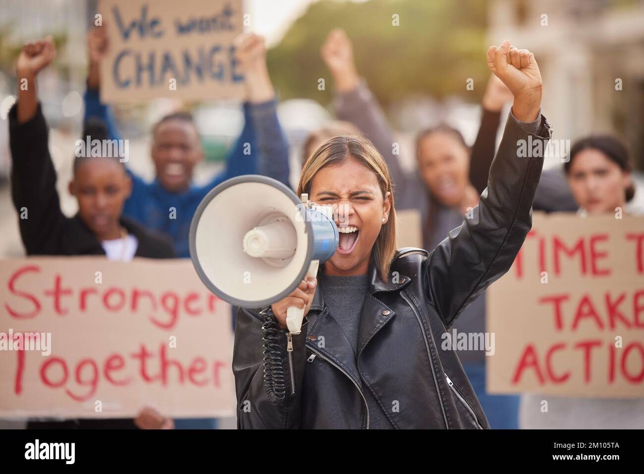 Protest, megaphone and shouting with woman in support for social