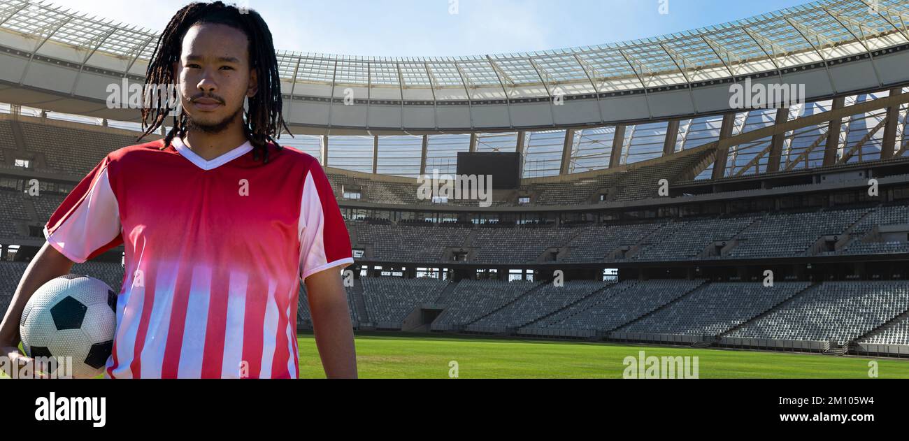portrait-of-confident-african-american-soccer-player-with-ball-at