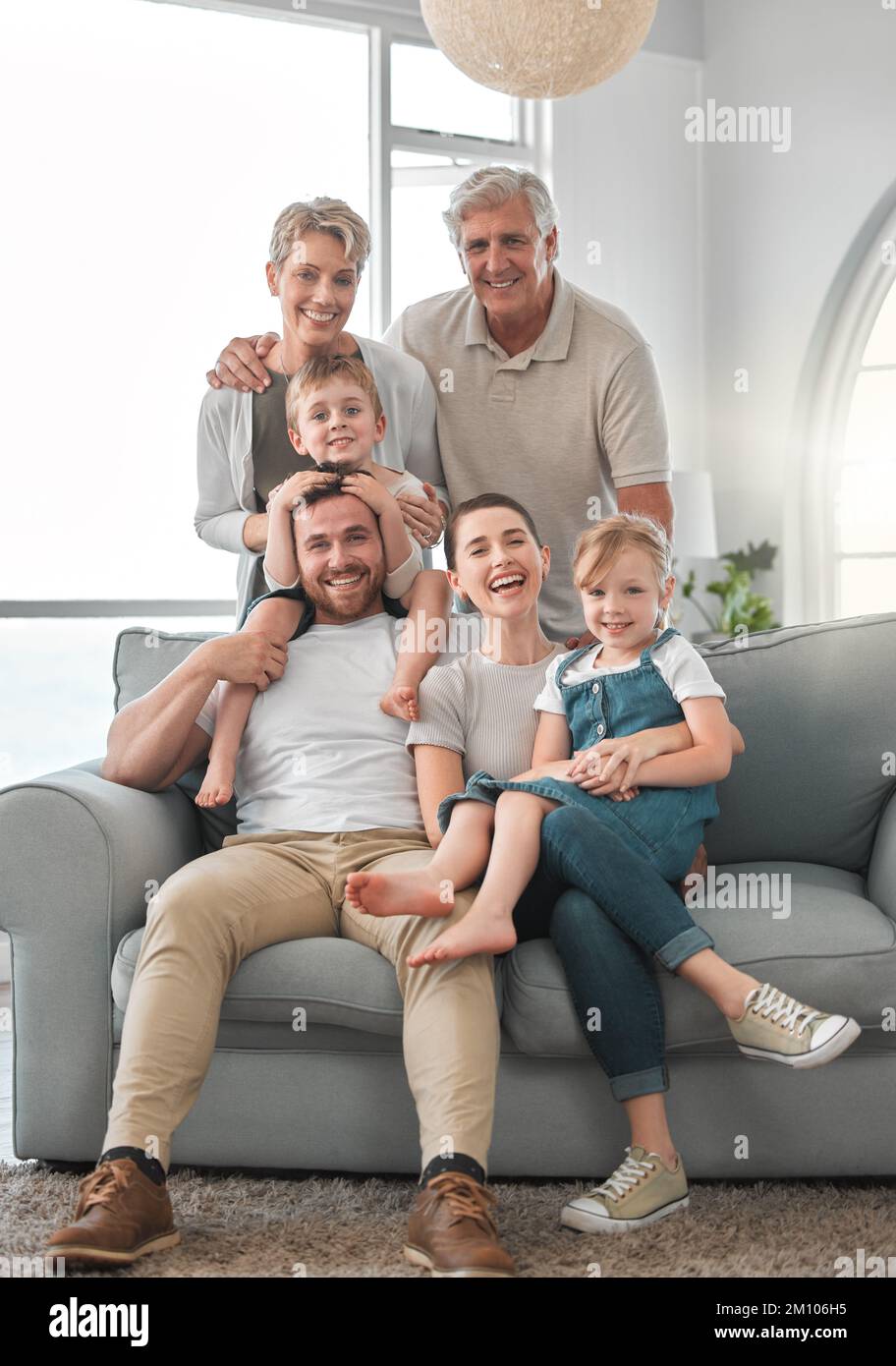 The memories we make with our family is everything. a happy family relaxing on the sofa at home. Stock Photo