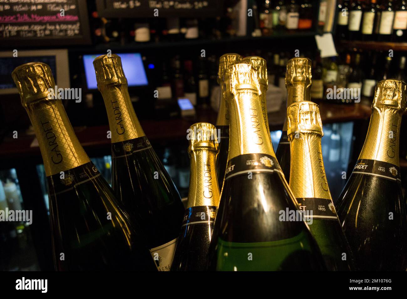 closeup of Maison Gardet champagne bottle necks in a wine bard in London Stock Photo
