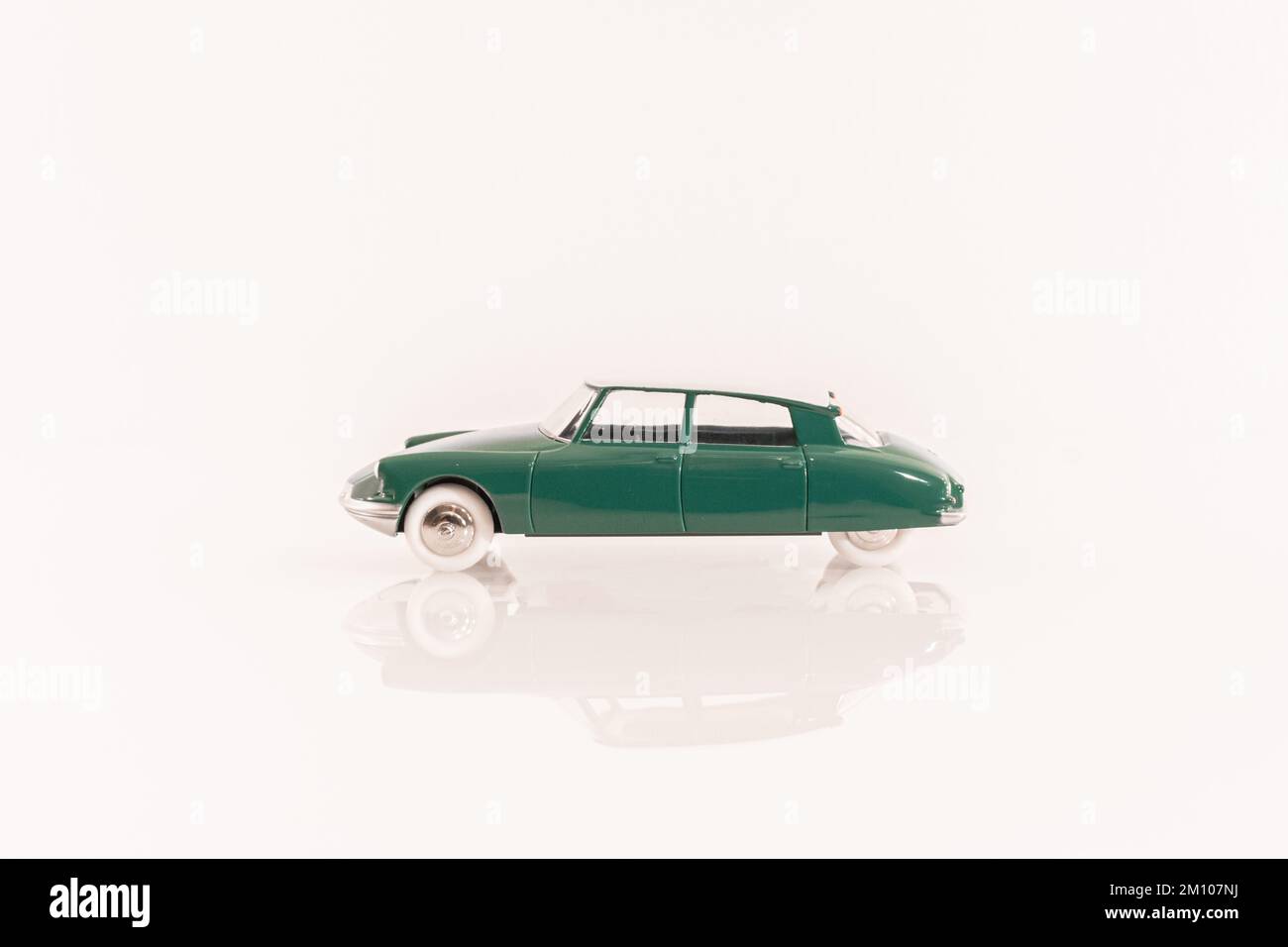 Miniature vehicle of collection of mark Citroen DS 19 of green color with white roof. Stock Photo